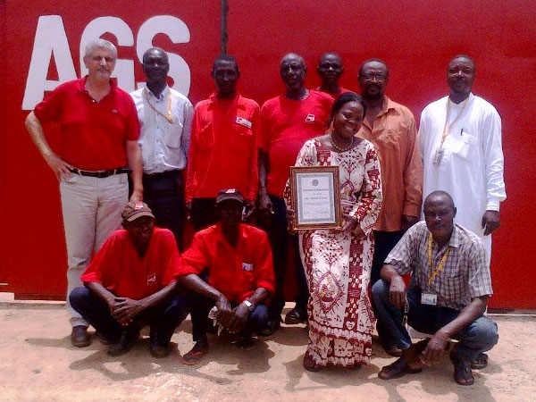 AGS staff Chad holding a certificate