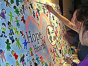 Kids painting hopeful hearts